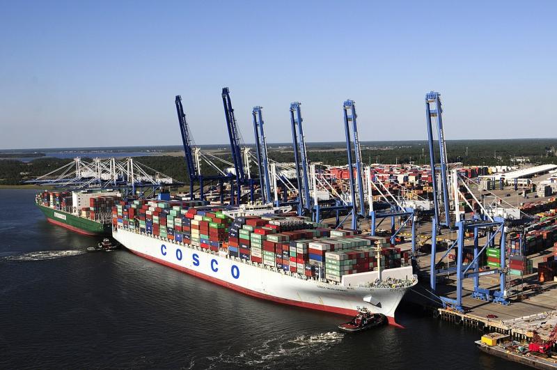 Container ships at port loading/unloading facility