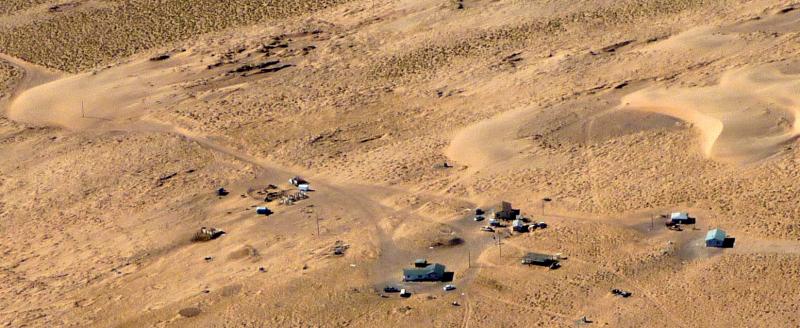 Aerial view of sand dunes threatening to engulf homes