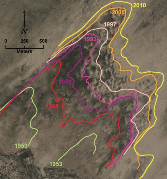 Annotated aerial photo showing dune field motion over time