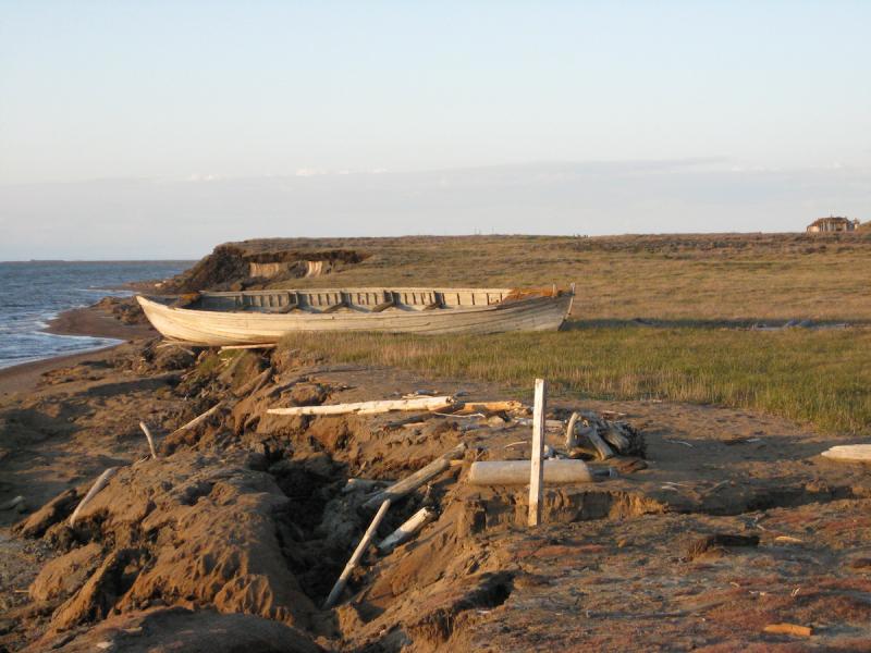 Photo of historic whaling boat on an eroding bluff